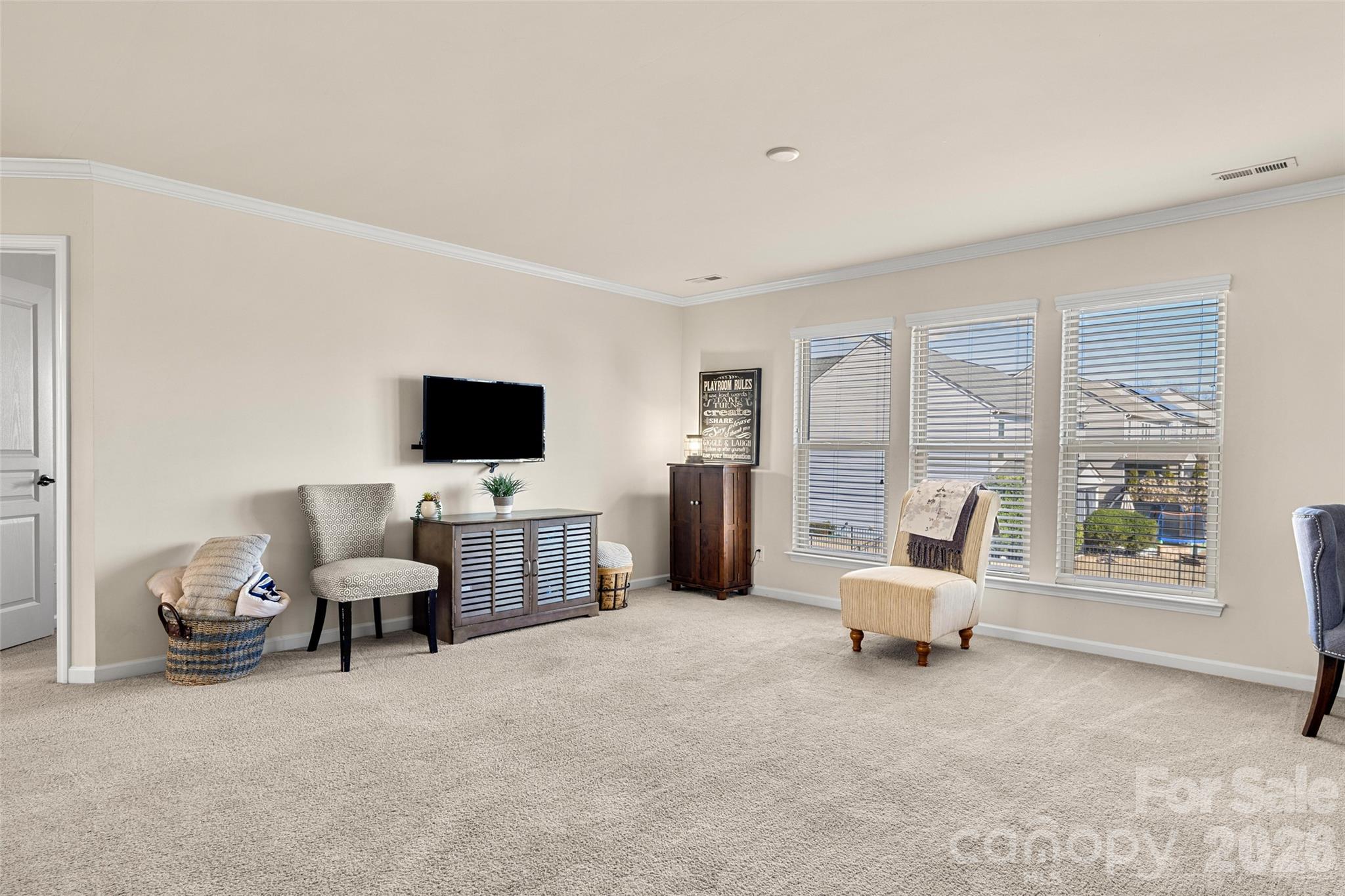 3534 Jumprock Road Fort Mill, SC 29707 - Photo 21 of 36 a living room with furniture and a flat screen tv