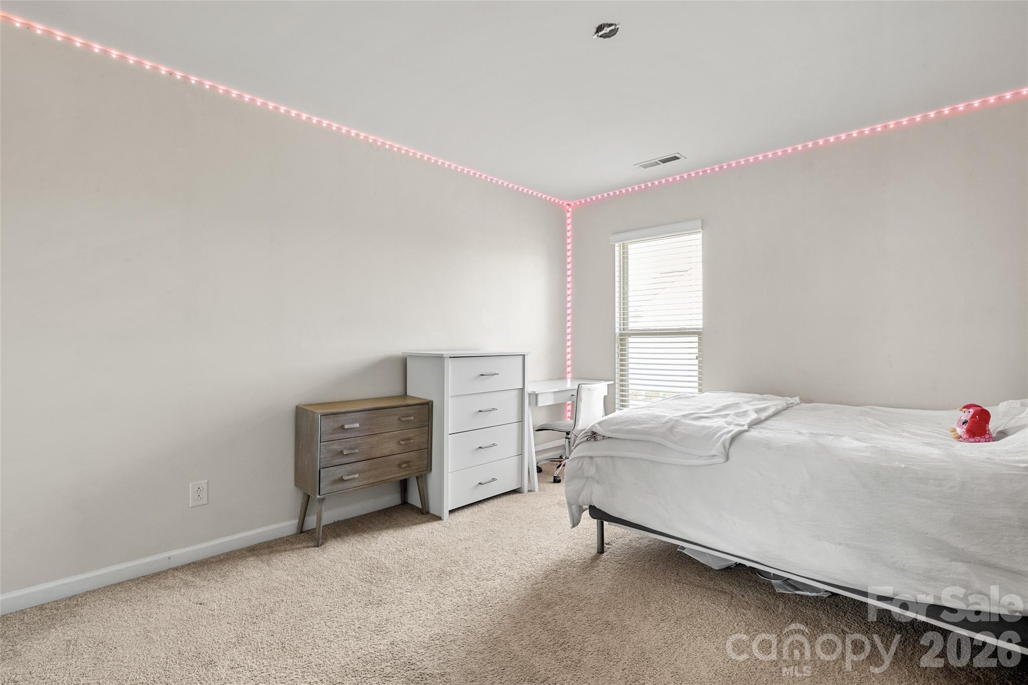 3534 Jumprock Road Fort Mill, SC 29707 - Photo 22 of 36 a bedroom with a bed and a window