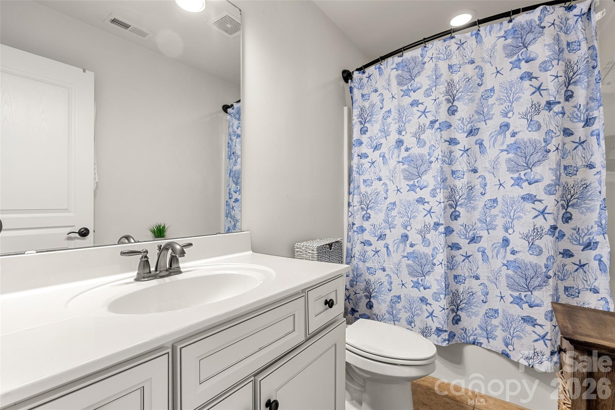 3534 Jumprock Road Fort Mill, SC 29707 - Photo 24 of 36 a bathroom with a sink toilet and a mirror