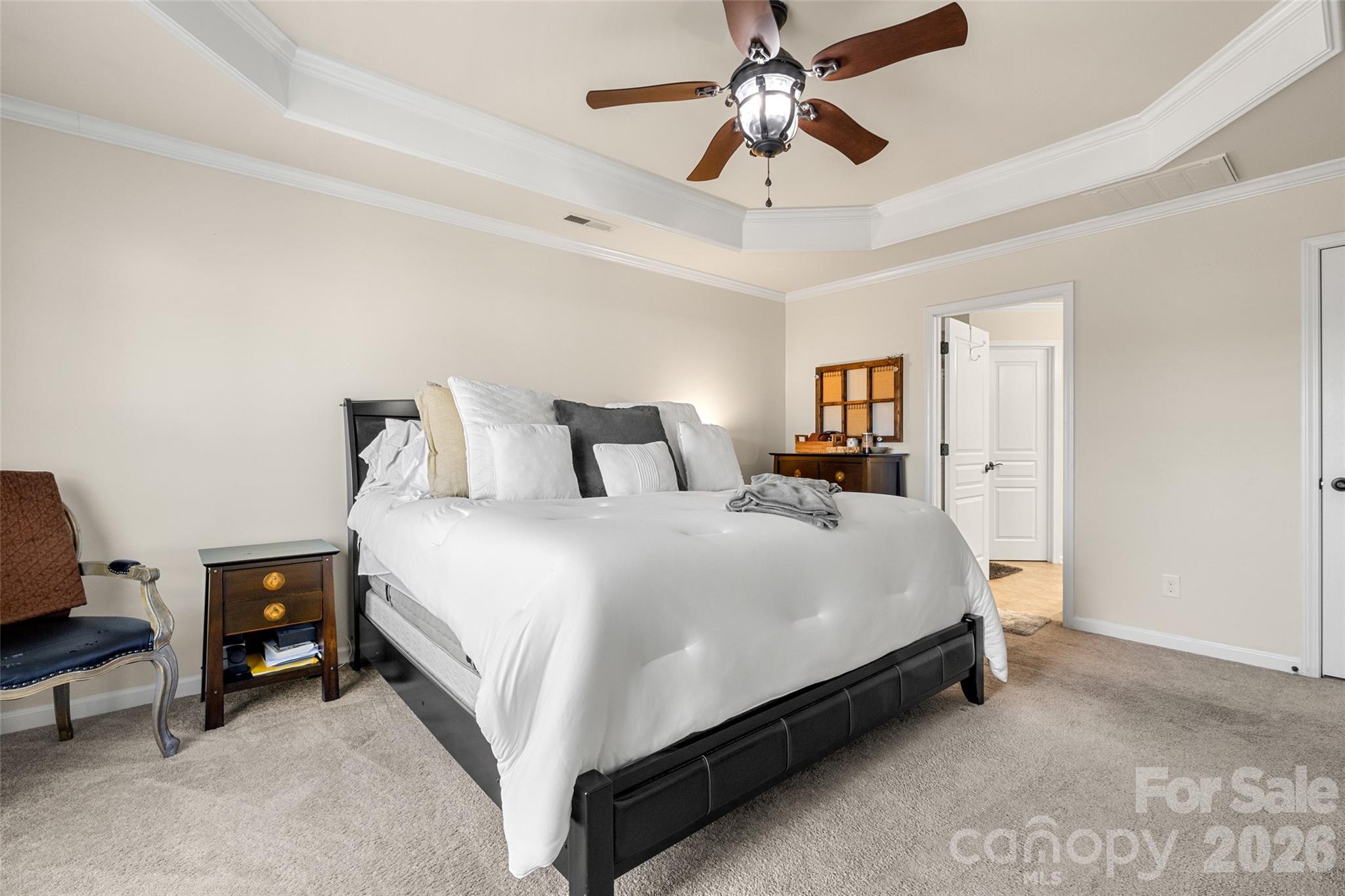 3534 Jumprock Road Fort Mill, SC 29707 - Photo 26 of 36 a bedroom with a bed and a chandelier