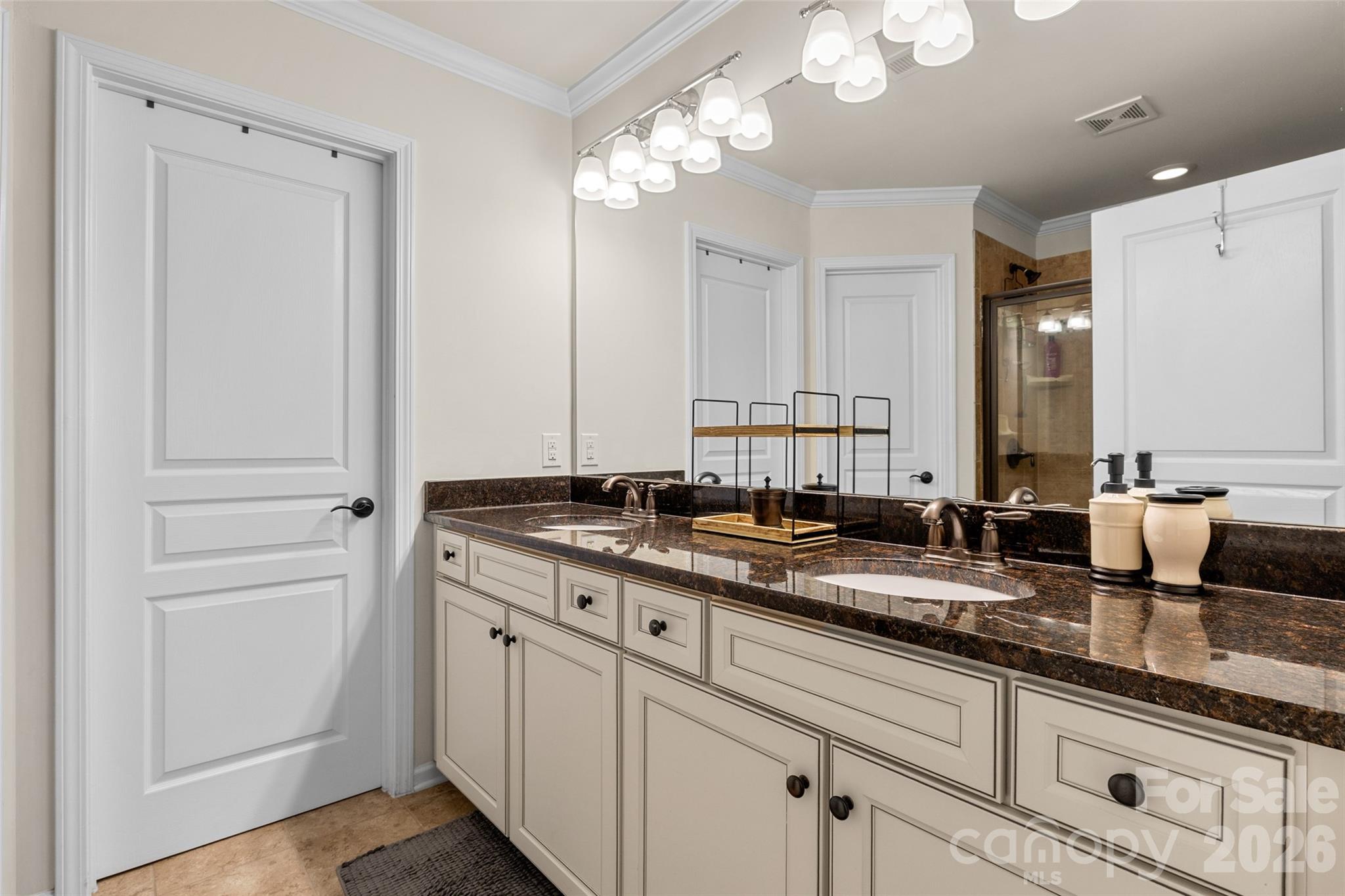 3534 Jumprock Road Fort Mill, SC 29707 - Photo 27 of 36 a bathroom with double sink and a mirror