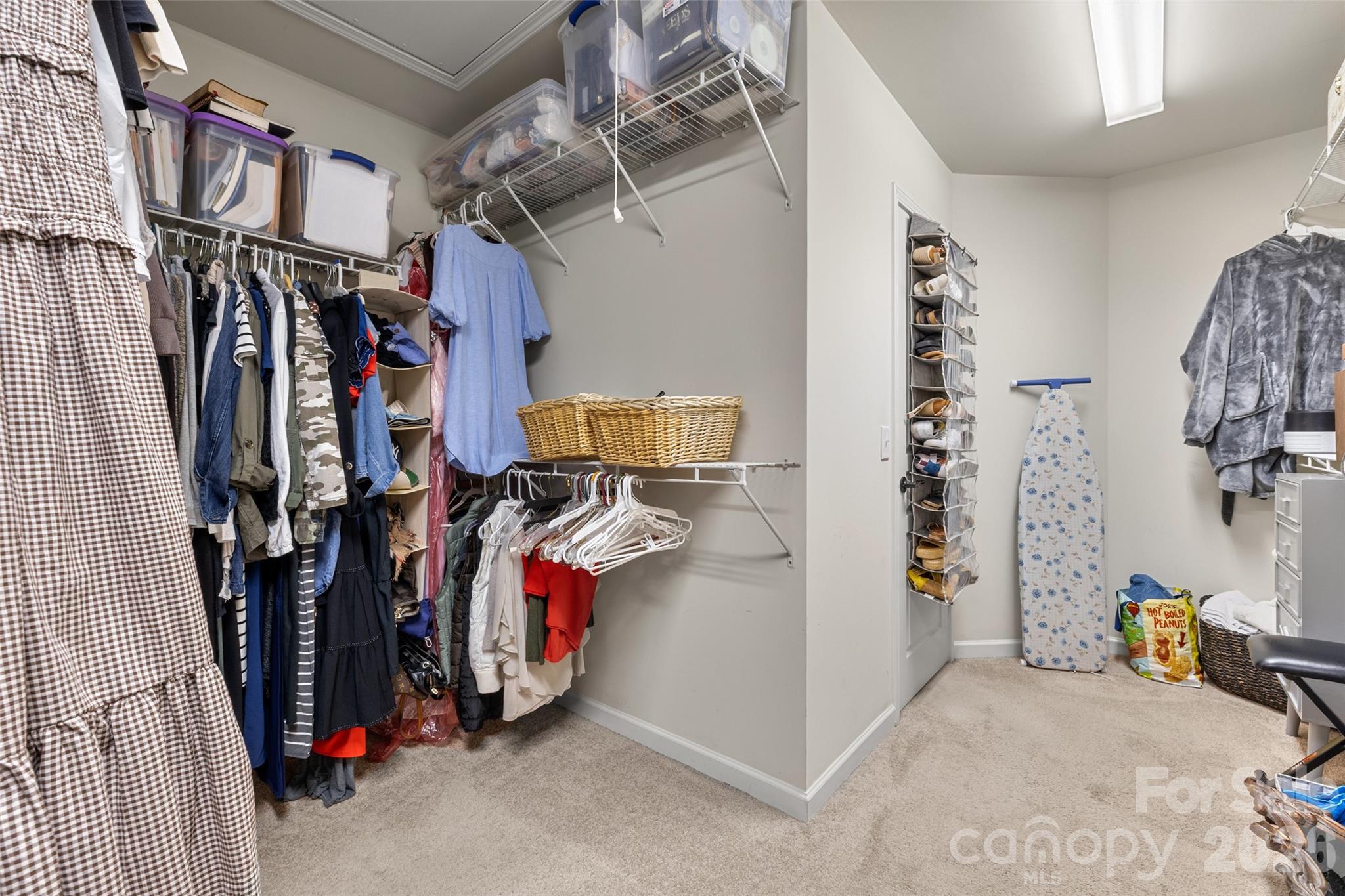 3534 Jumprock Road Fort Mill, SC 29707 - Photo 29 of 36 a view of walk in closet with clothes and shoes