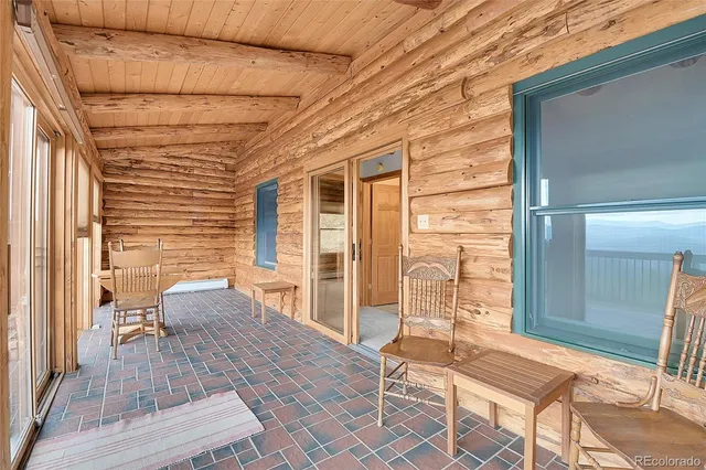 a view of an empty room with a fireplace