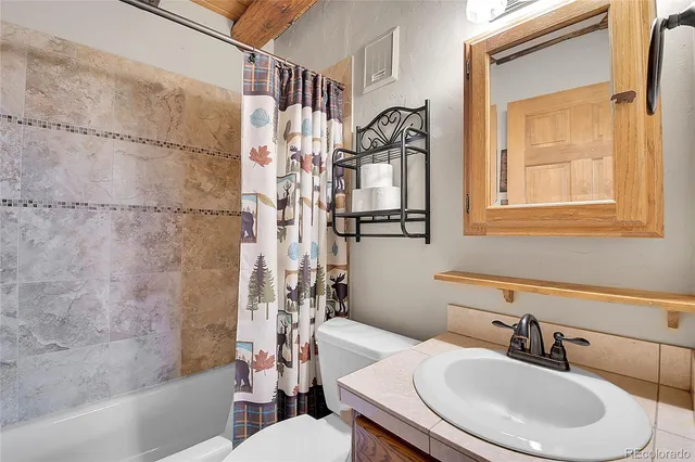 a view of an empty room with a fireplace