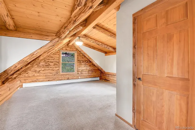 a view of a porch with wooden walls