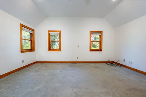 a view of a hallway with a dresser