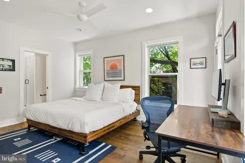 a bedroom with a bed and a table