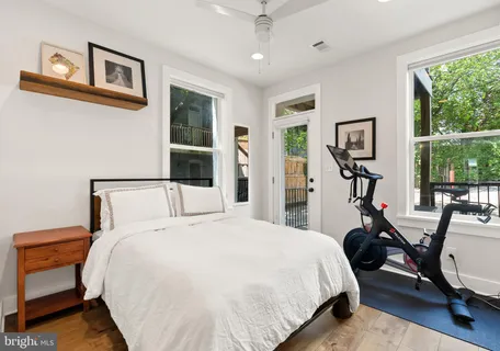 a bed room with a bed and a chair