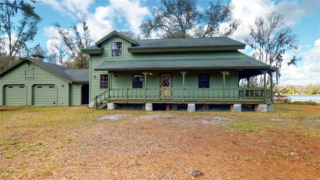 19803 Reading Road Lutz, FL 33558 - Photo 2 of 48 a front view of a house with garden