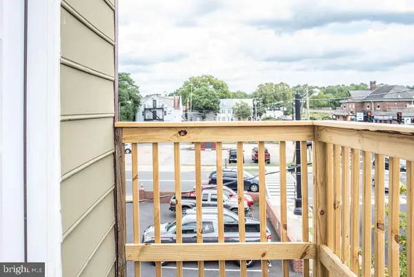 a view of a large building with a large window and deck