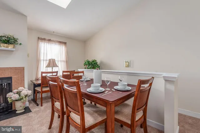 a view of a dining room with furniture and window