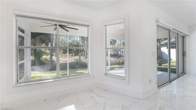 a kitchen with stainless steel appliances granite countertop a sink and a stove top oven with wooden floor