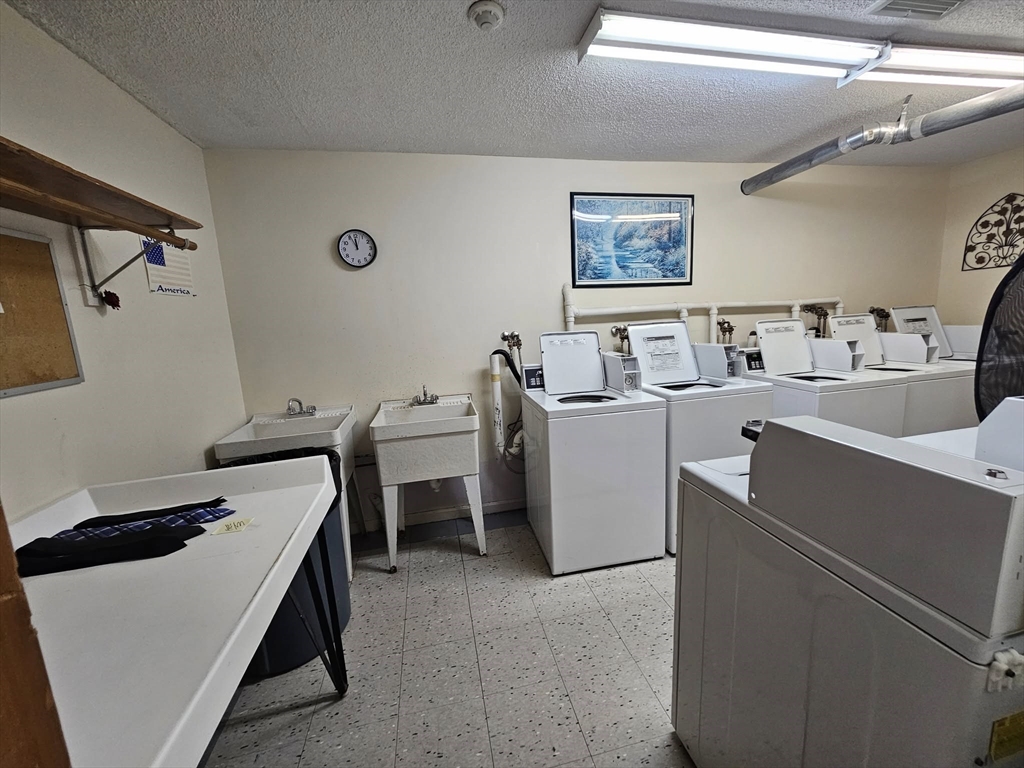 35 Prospect Street, Unit 215 Woburn, MA 01801 - Photo 20 of 37 a room with storage and utility