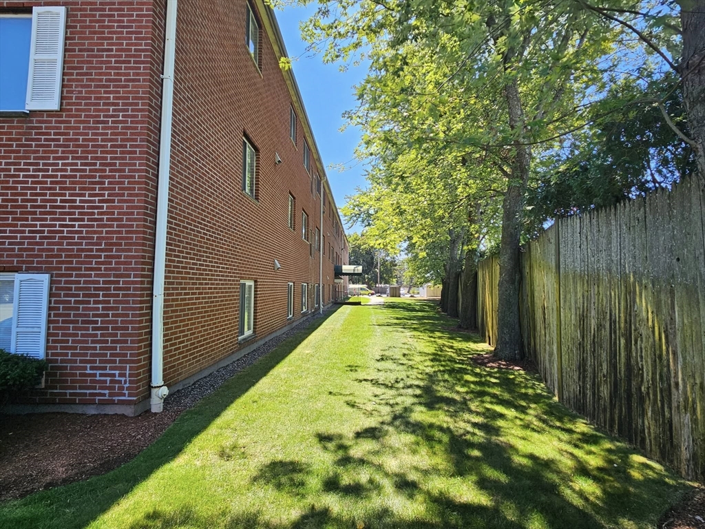 35 Prospect Street, Unit 215 Woburn, MA 01801 - Photo 27 of 37 a view of backyard with garden