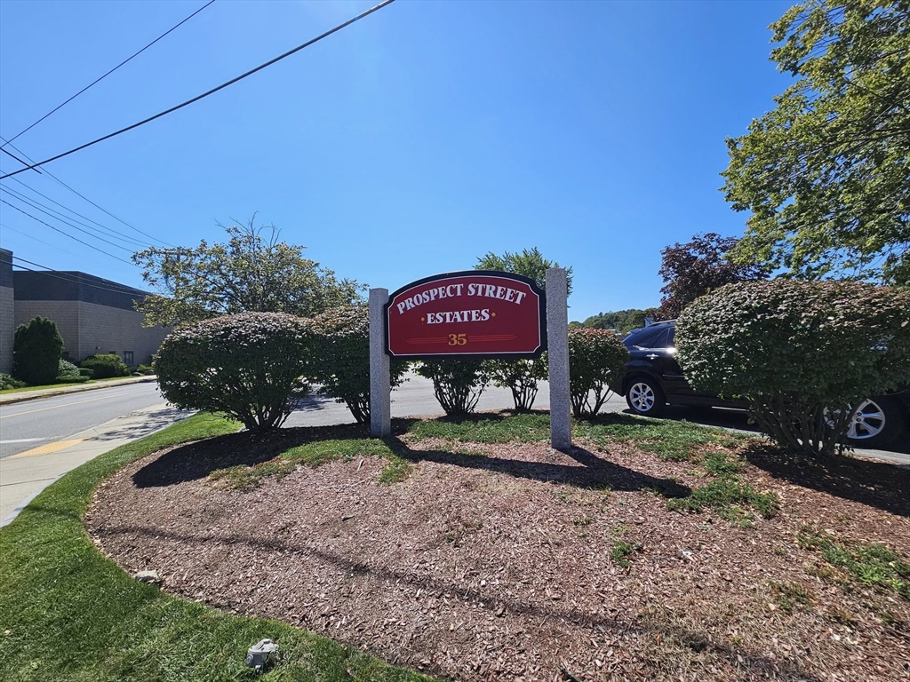 35 Prospect Street, Unit 215 Woburn, MA 01801 - Photo 28 of 37 a sign on the side of the road