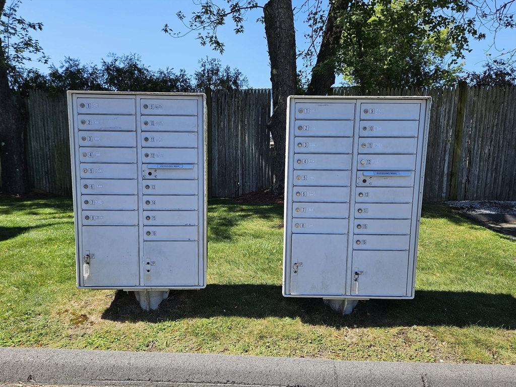 35 Prospect Street, Unit 215 Woburn, MA 01801 - Photo 29 of 37 a view of a back yard of the house