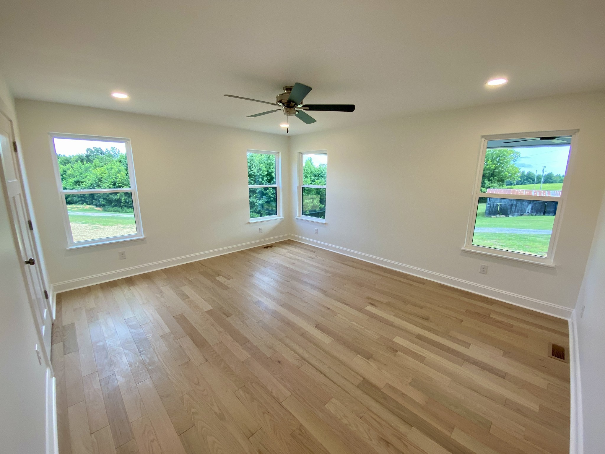 25 Ferguson Hollow Road Chestnut Mound, TN 38552 - Photo 12 of 49 an empty room with wooden floor and windows