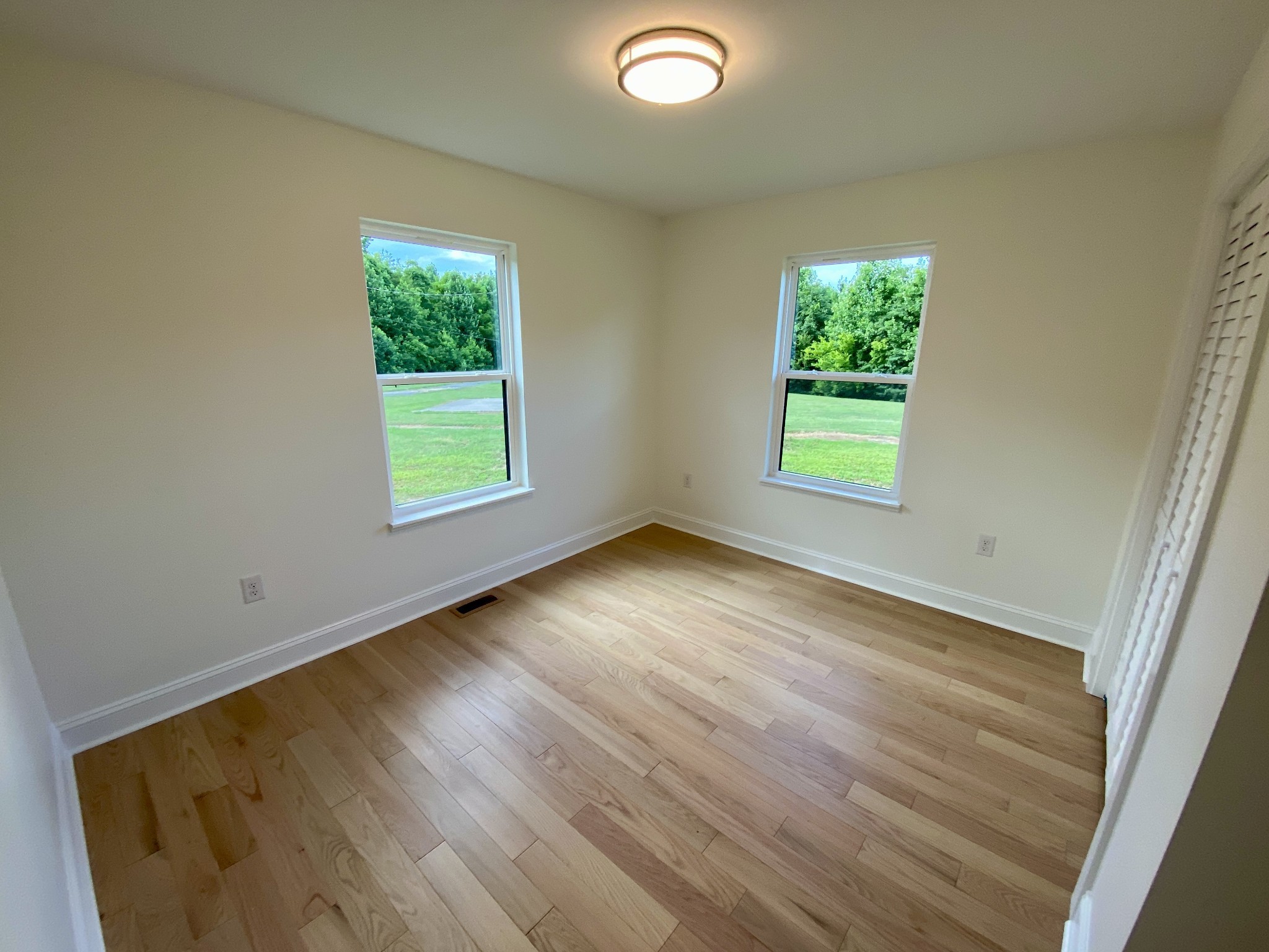 25 Ferguson Hollow Road Chestnut Mound, TN 38552 - Photo 24 of 49 an empty room with wooden floor and windows