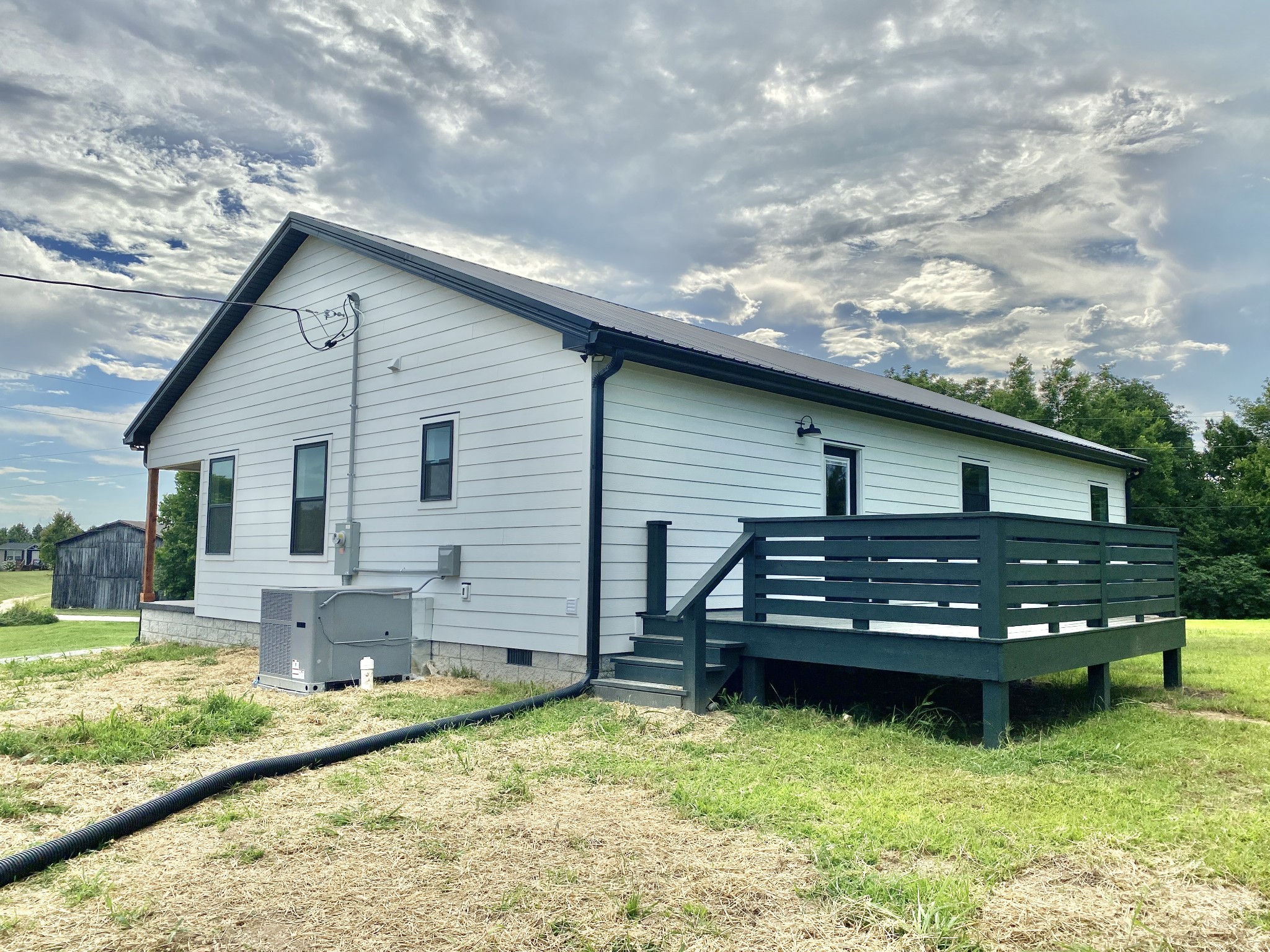 25 Ferguson Hollow Road Chestnut Mound, TN 38552 - Photo 37 of 49 a backyard of a house with dishwasher and garden