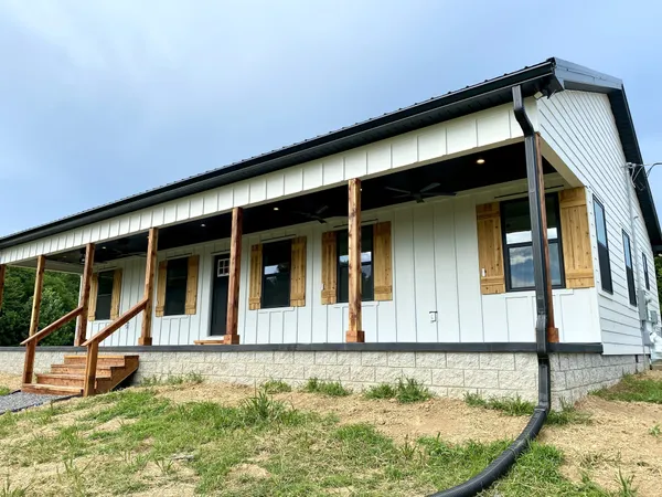front view of a house with a yard