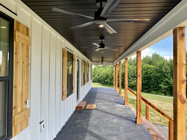 a view of a porch with furniture