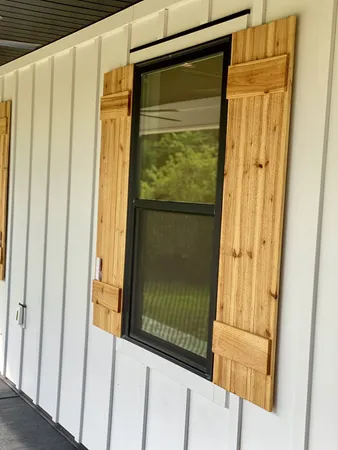 a view of a porch and garden