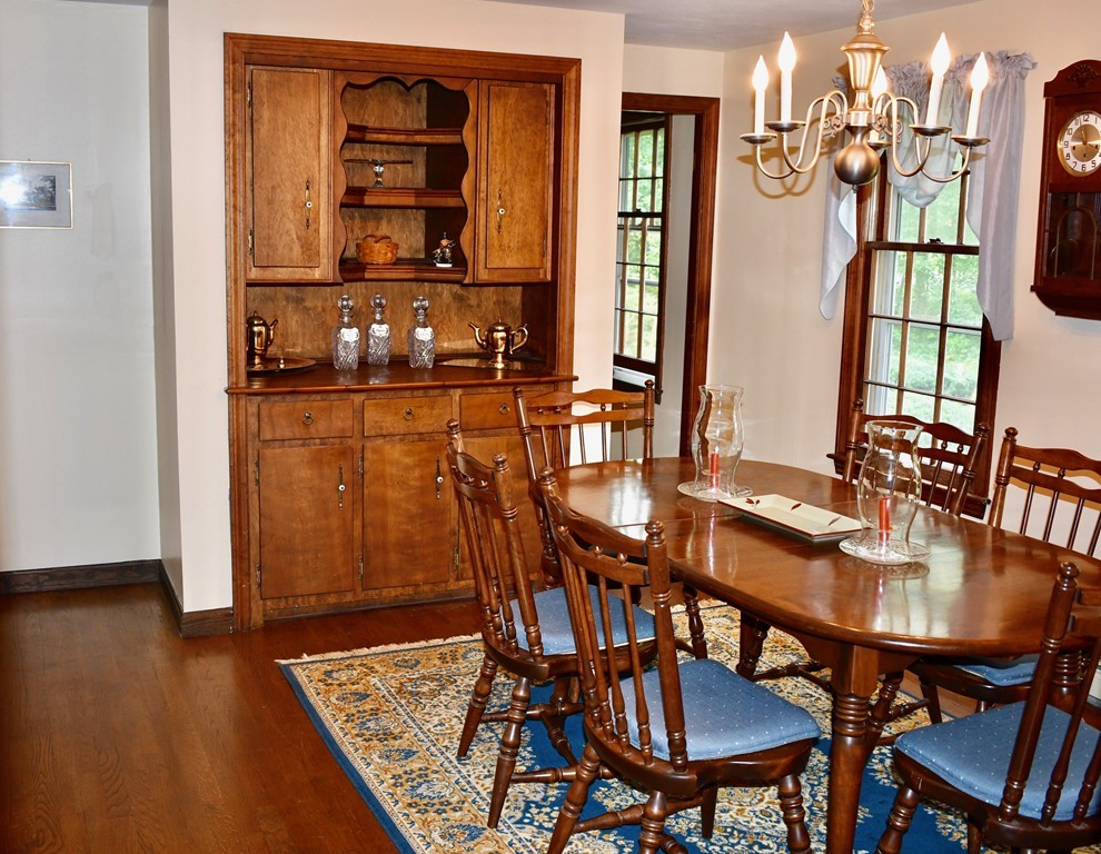 202 Pepperell Road Groton, MA 01450 - Photo 12 of 30 a dining room with furniture and wooden floor