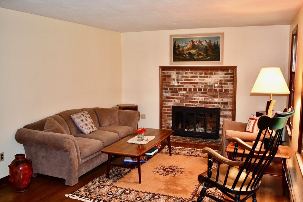 202 Pepperell Road Groton, MA 01450 - Photo 13 of 30 a living room with furniture and a fireplace