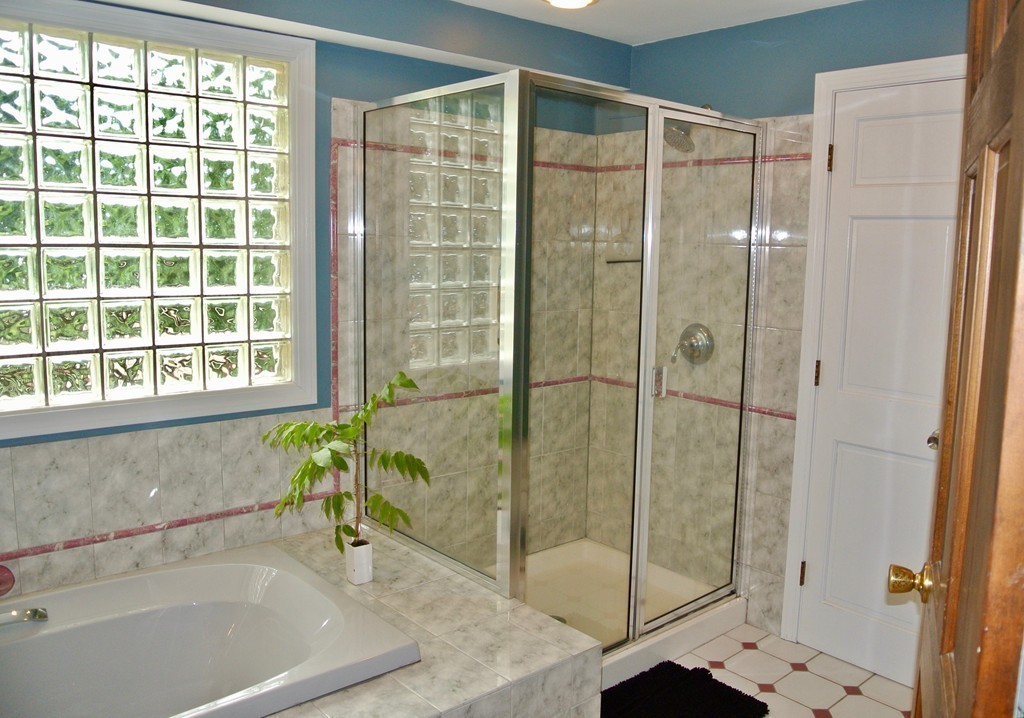 202 Pepperell Road Groton, MA 01450 - Photo 15 of 30 a bathroom with a shower and a bathtub