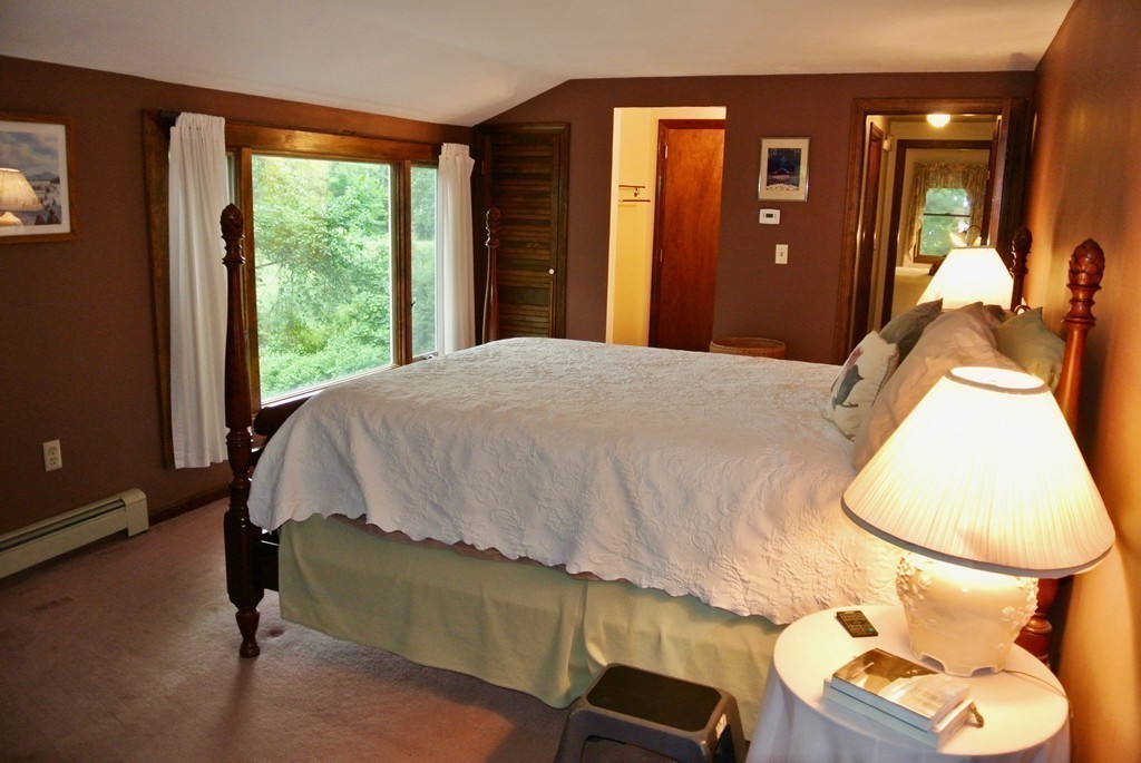 202 Pepperell Road Groton, MA 01450 - Photo 23 of 30 a bedroom with a bed and a window