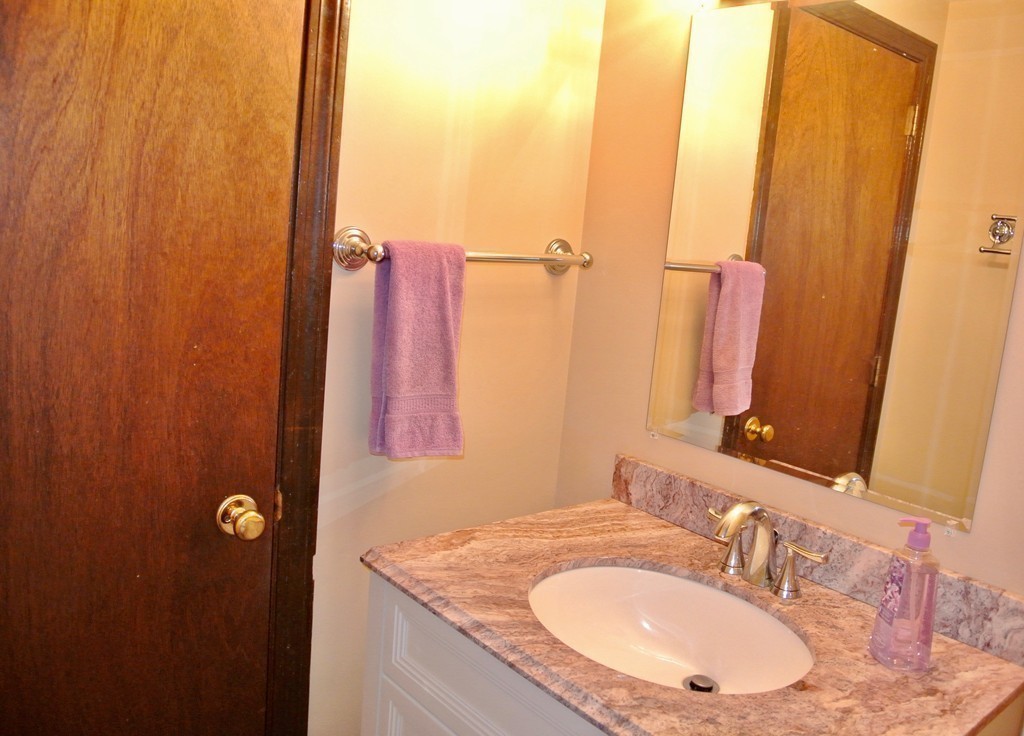 202 Pepperell Road Groton, MA 01450 - Photo 24 of 30 a bathroom with a granite countertop sink and a mirror