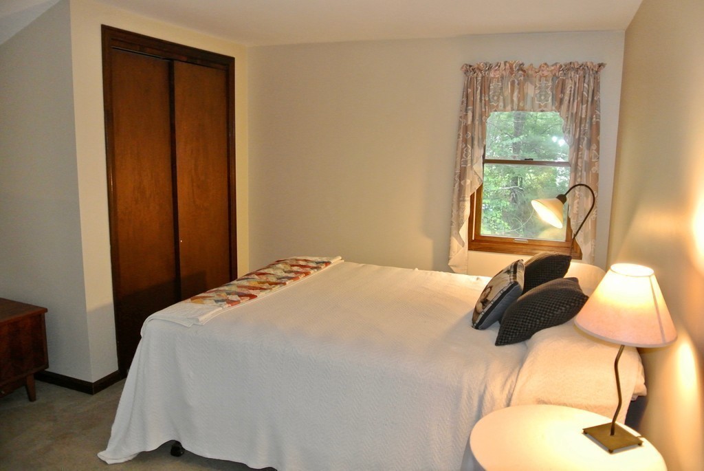 202 Pepperell Road Groton, MA 01450 - Photo 27 of 30 a bedroom with a bed and a window