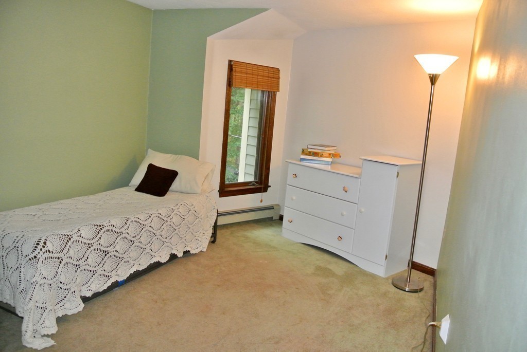202 Pepperell Road Groton, MA 01450 - Photo 28 of 30 a bedroom with a bed and a mirror