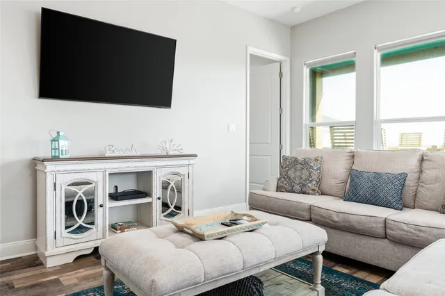 a living room with furniture fireplace and flat screen tv