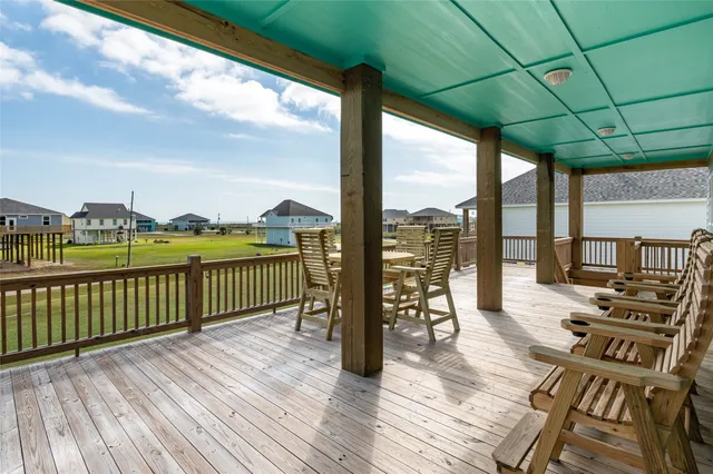 a view of a balcony with wooden floor