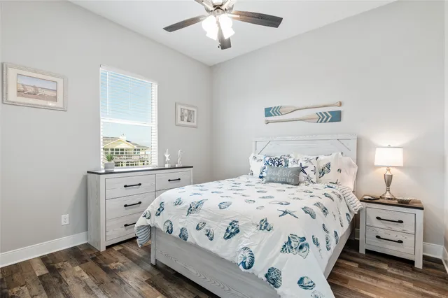 a bedroom with a bed and a dresser