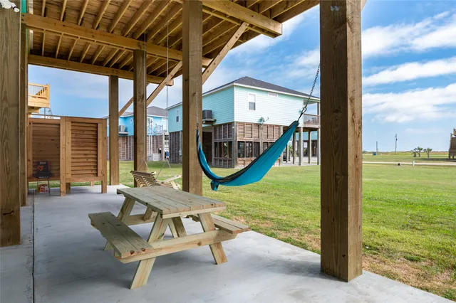 a view of a work space with a table and chairs