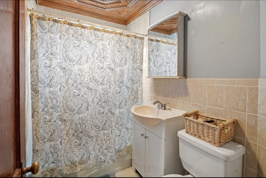 55 Austin Street Boston, MA 02136 - Photo 15 of 24 a bathroom with a sink and toilet