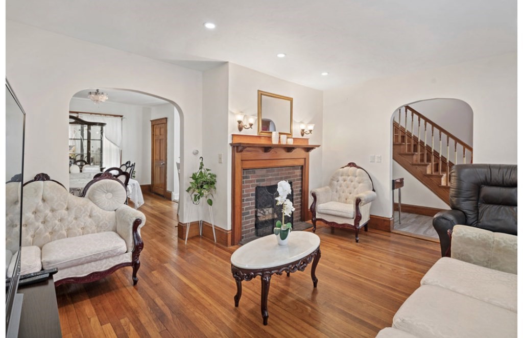 55 Austin Street Boston, MA 02136 - Photo 24 of 24 a living room with furniture a fireplace and a table