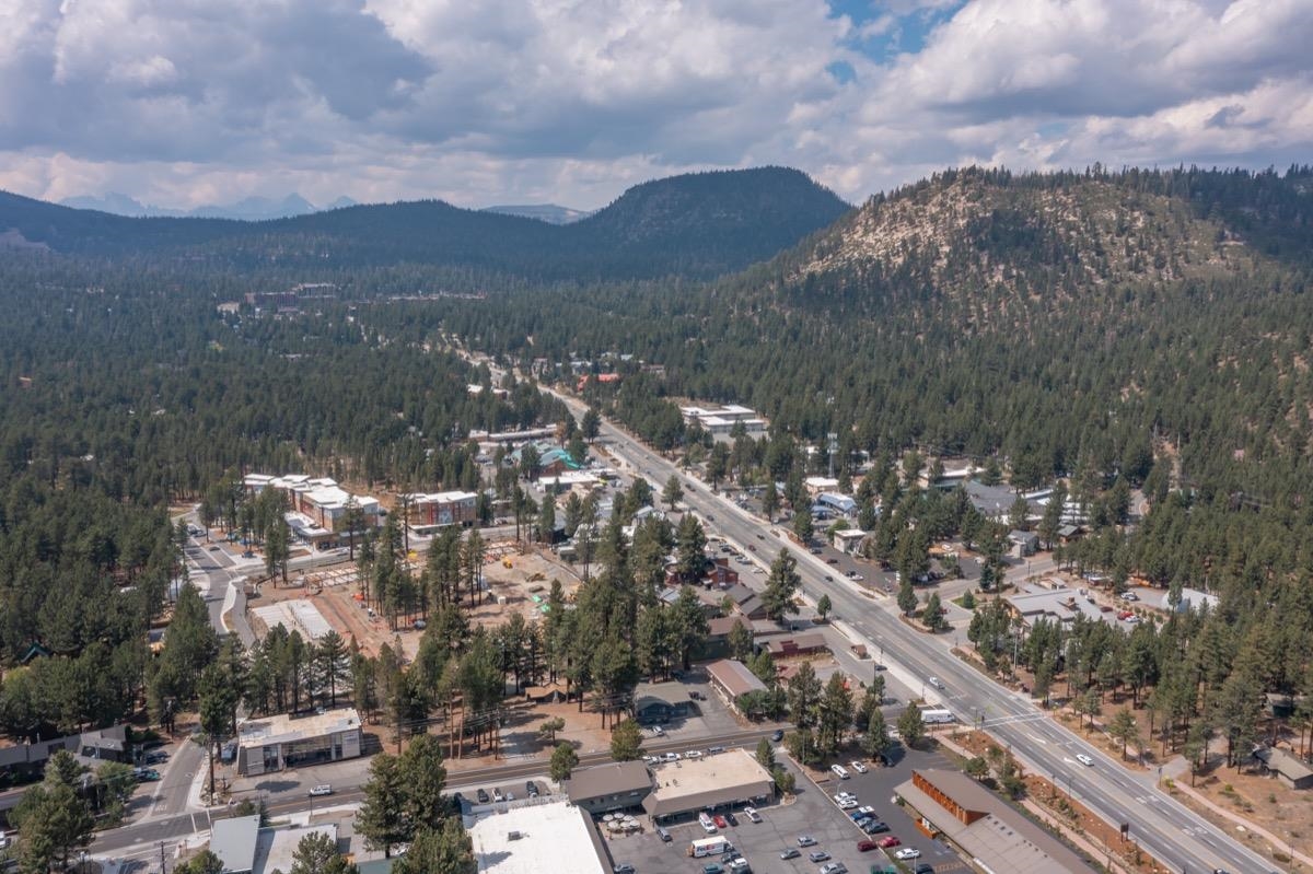 76 Laurel Mountain Road Mammoth Lakes, CA 93546 - Photo 29 of 30 Aerial view of property and surrounding area with a heavily wooded area and a mountainous background