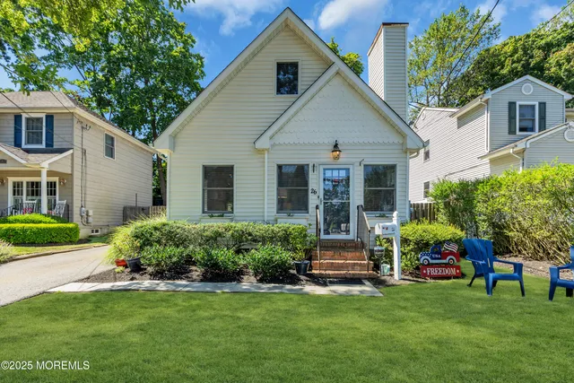 front view of a house with a yard
