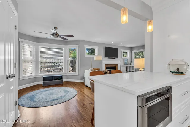 a view of kitchen with sink stove and refrigerator