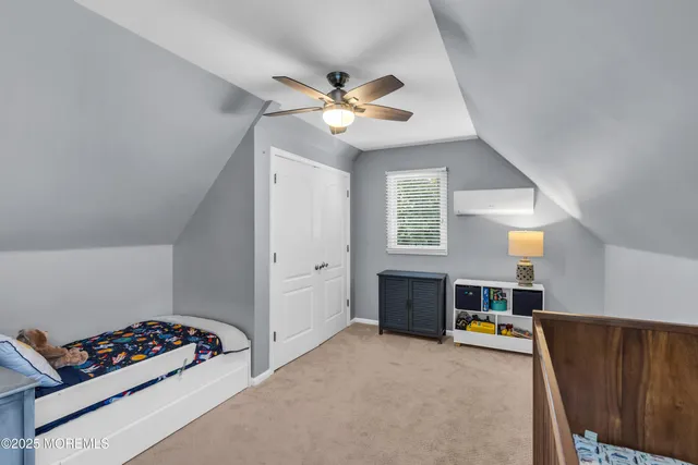 a bedroom with furniture and a window