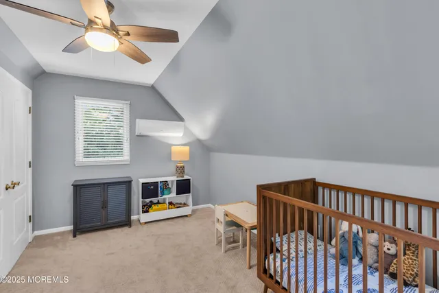 a bedroom with furniture and a window