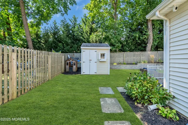 a view of a backyard with a garden and plants