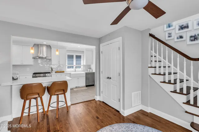 a kitchen with stainless steel appliances kitchen island a chandelier