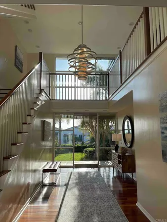 a kitchen with stainless steel appliances kitchen island granite countertop a sink and wooden cabinets