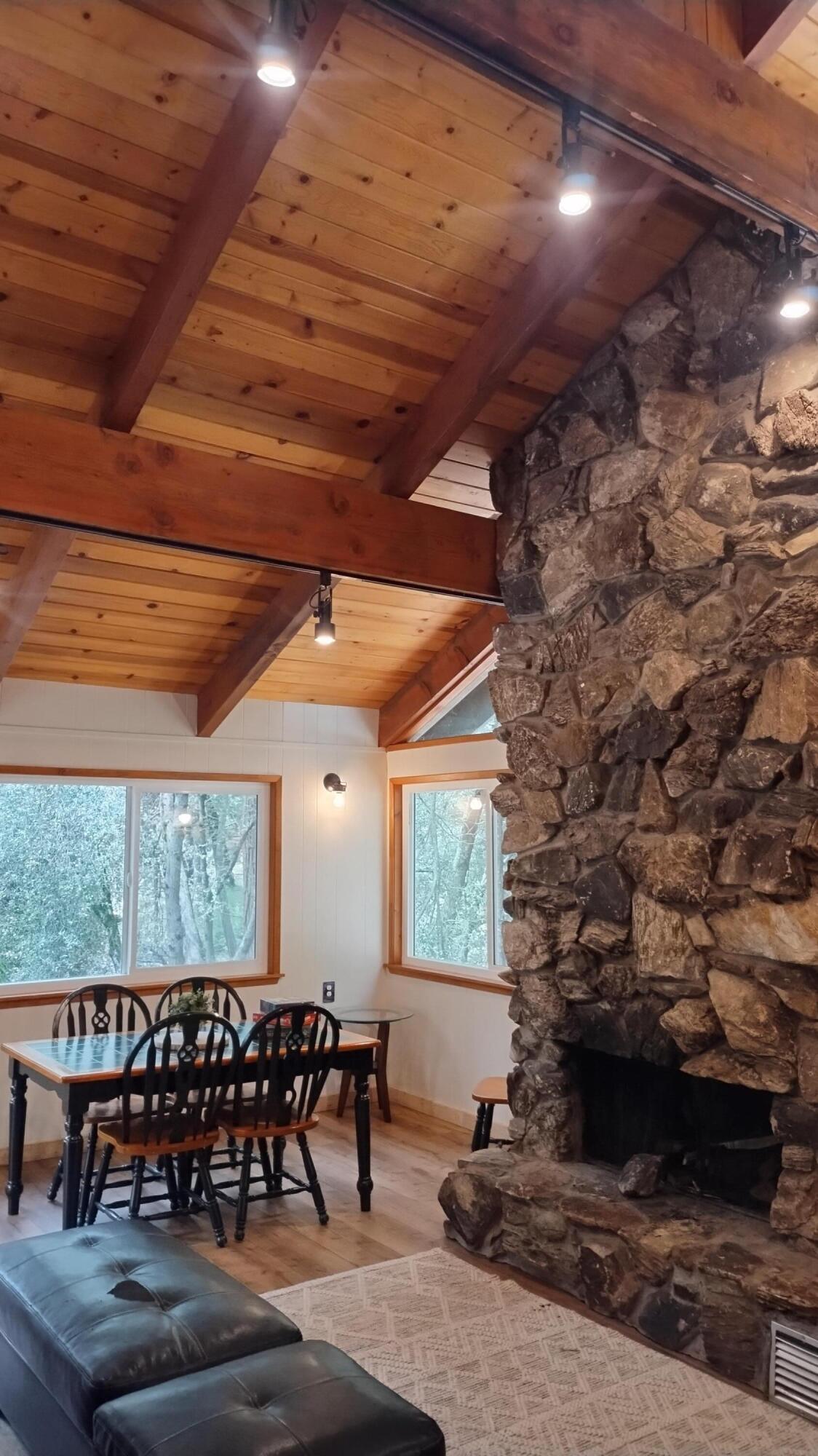 1693 Forest Rte 21S94 Camp Nelson, CA 93265 - Photo 28 of 86 a living room with furniture a window and outdoor view