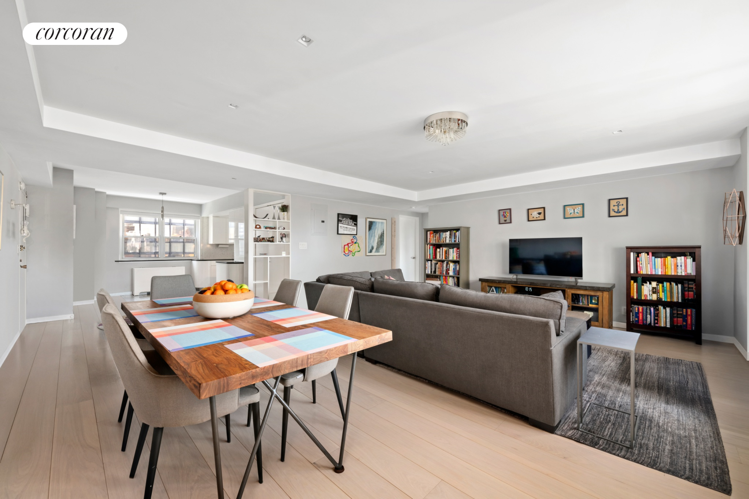 345 East 56th Street, Unit 21F Manhattan, NY 10022 - Photo 2 of 9 a living room with furniture and a flat screen tv