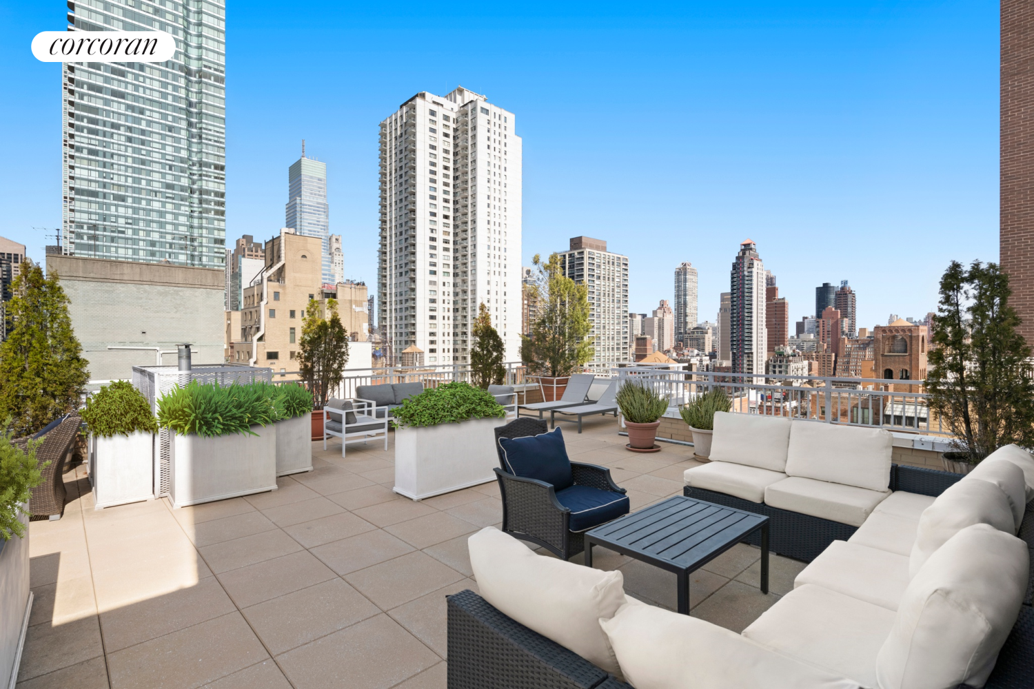 345 East 56th Street, Unit 21F Manhattan, NY 10022 - Photo 8 of 9 a view of a terrace with potted plants and white walls